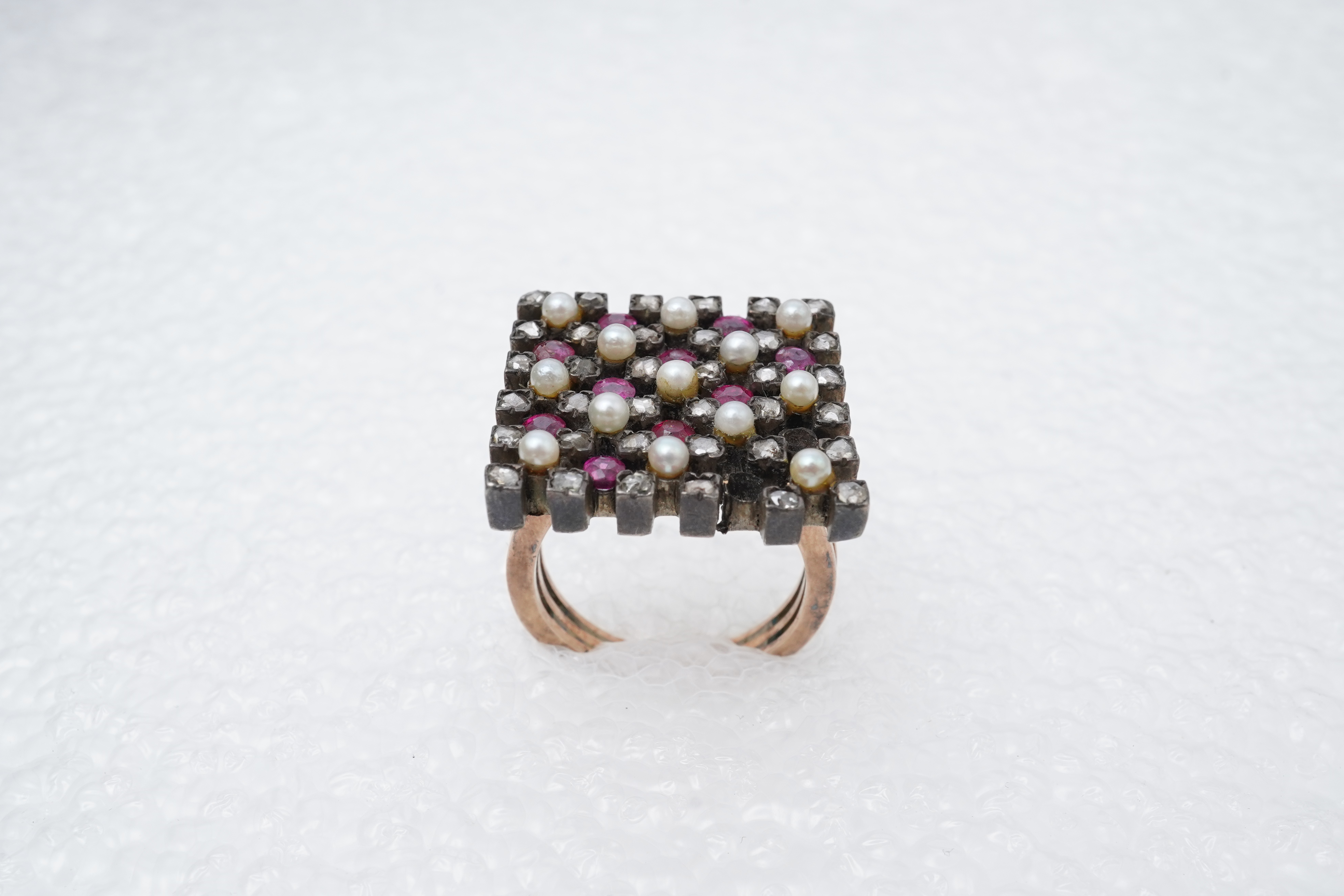 A synthetic ruby, seed pearl and diamond ring